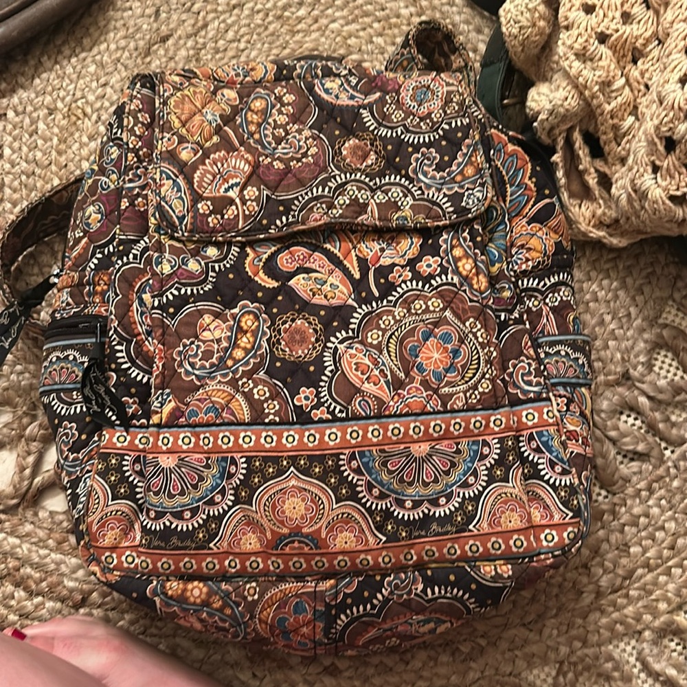 Brown Vera Bradley backpack with multiple pockets inside& out. WB holder.
